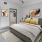 a bedroom with a bed and a fan