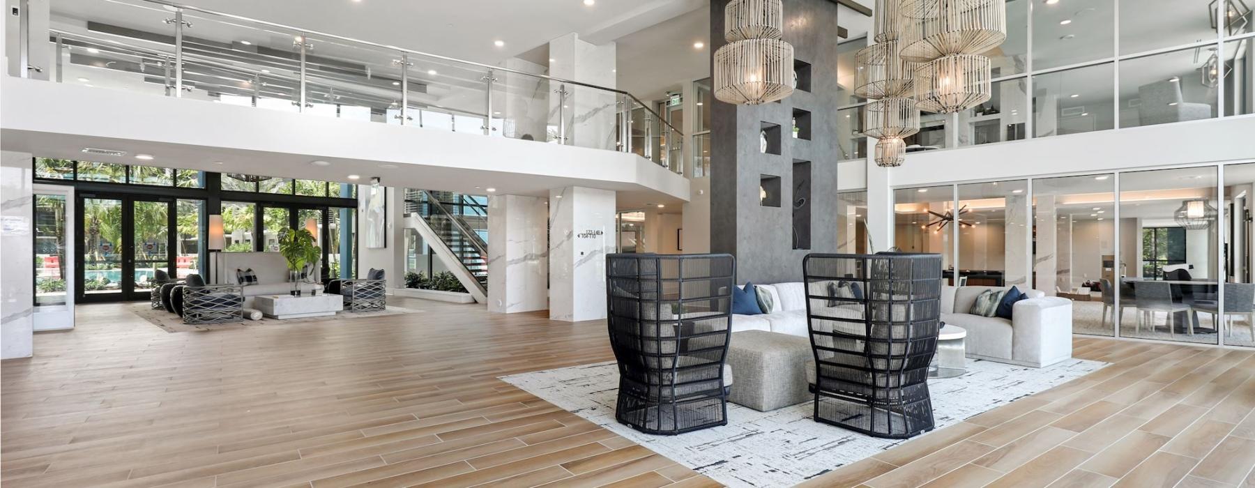 a large room with a large wooden floor and a large chandelier